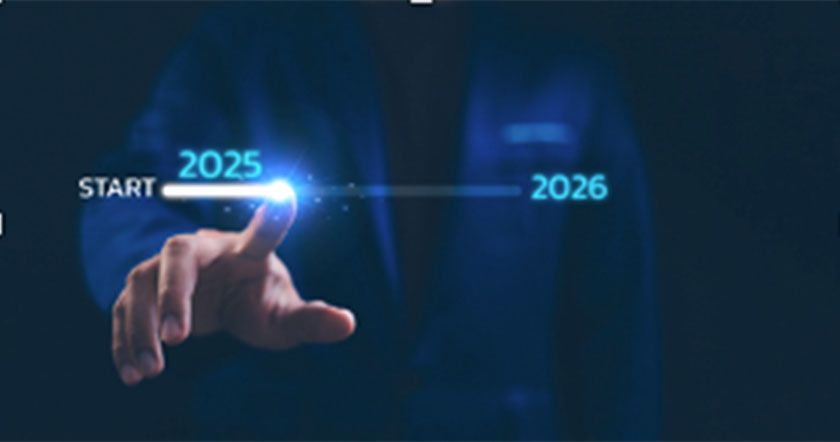 Hand touching a glowing process bar from 2025 to 2026, symbolizing forward progress
